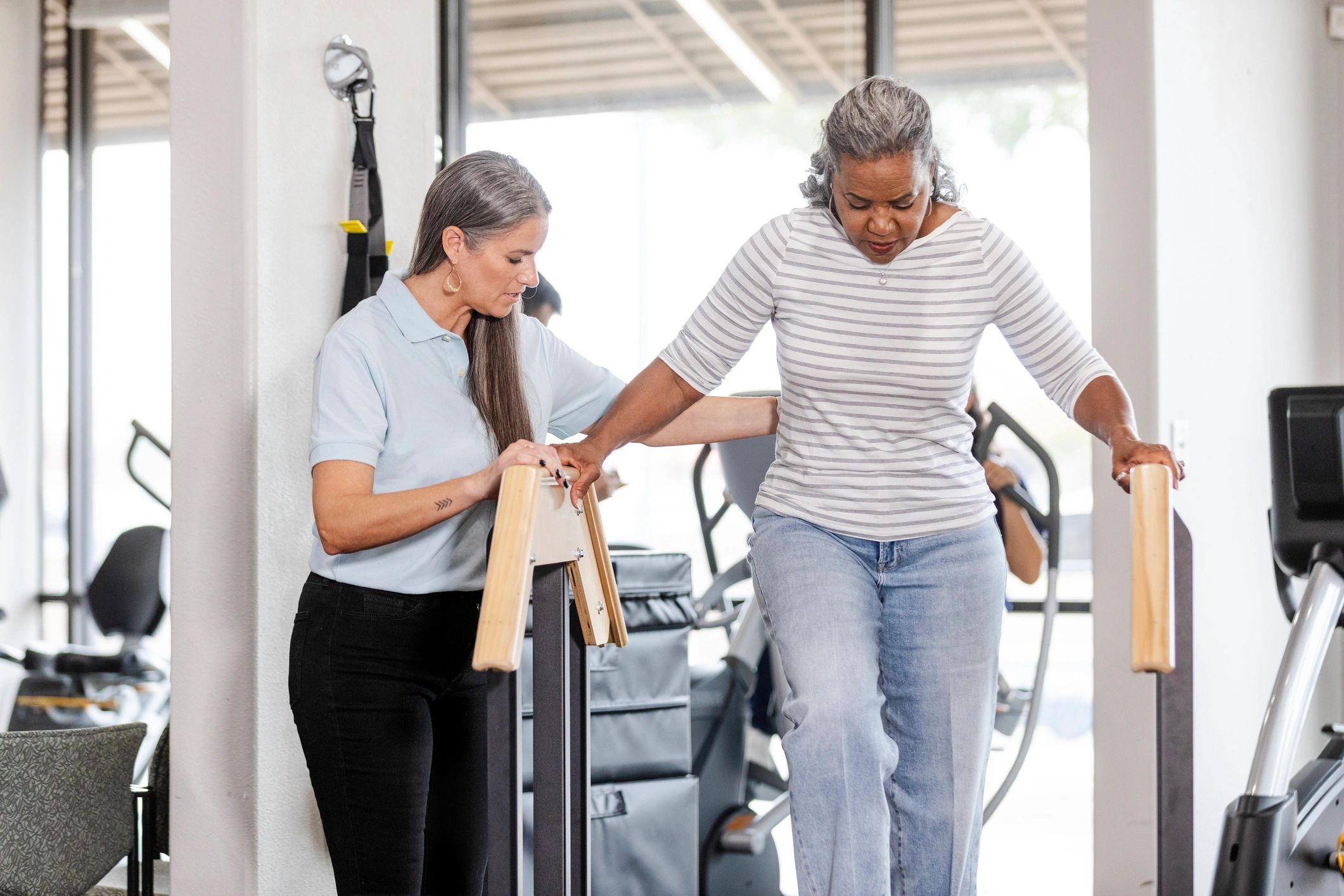 Speech therapist helping senior with communication skills